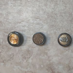 Black and gold tone button covers